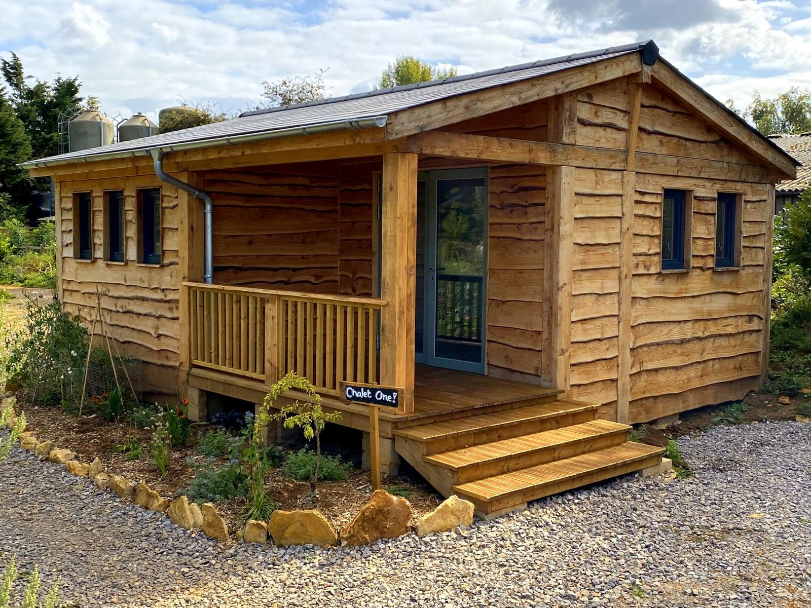 Holiday chalet with covered porch, balustrade and steps