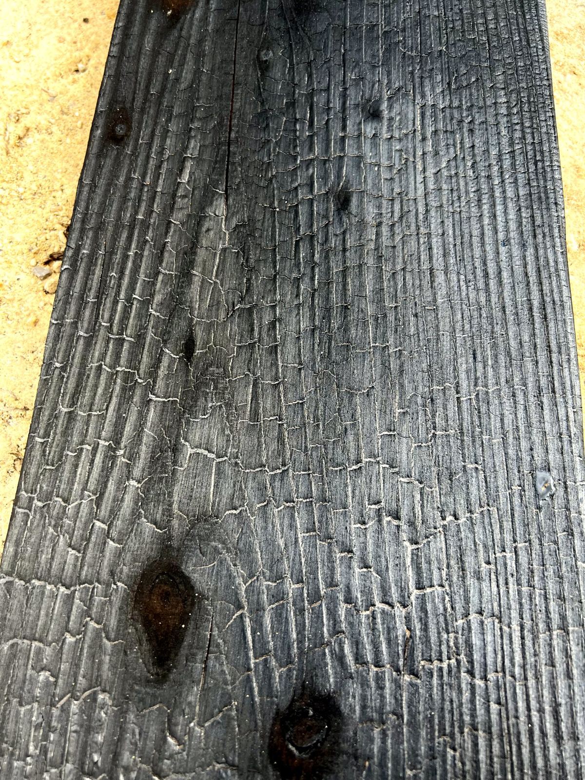 Close-up of crackled charred surface