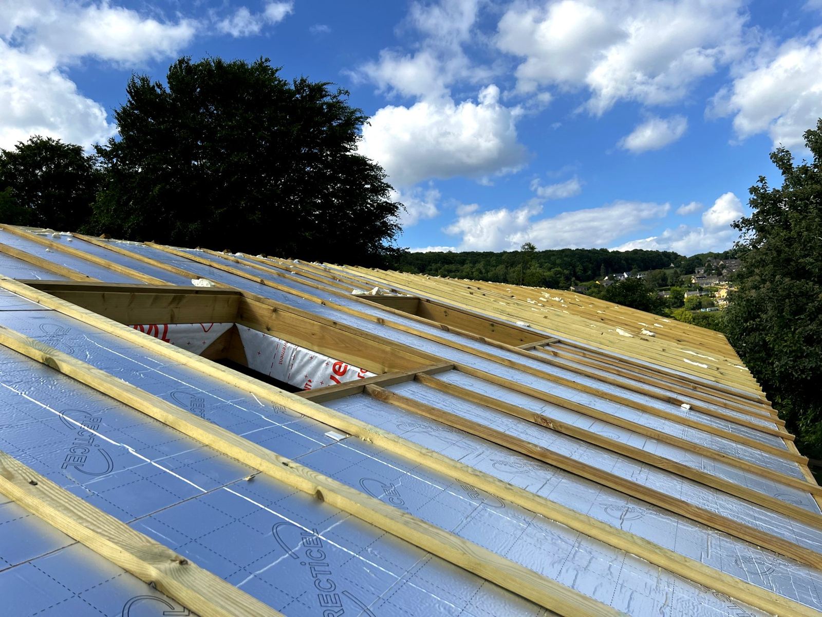 New roof insulated and counter-battened, with openings trimmed for rooflights